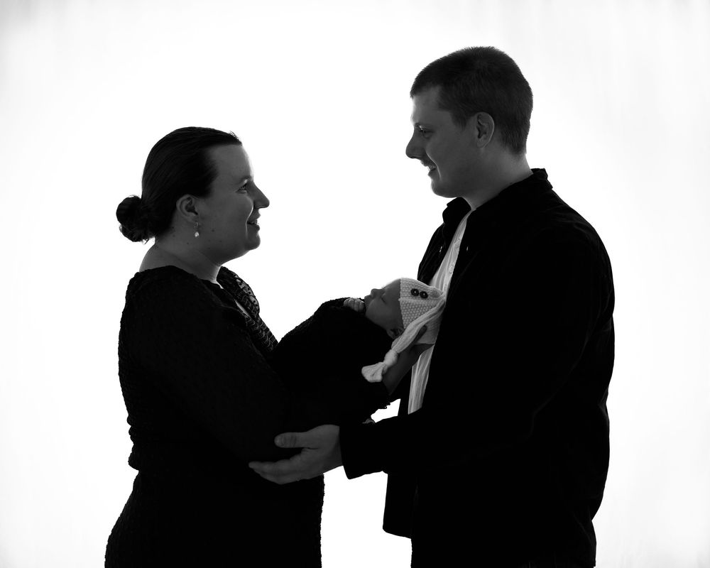 Black and white silhouettes of people in conversation and interaction shown in a series of connected poses.