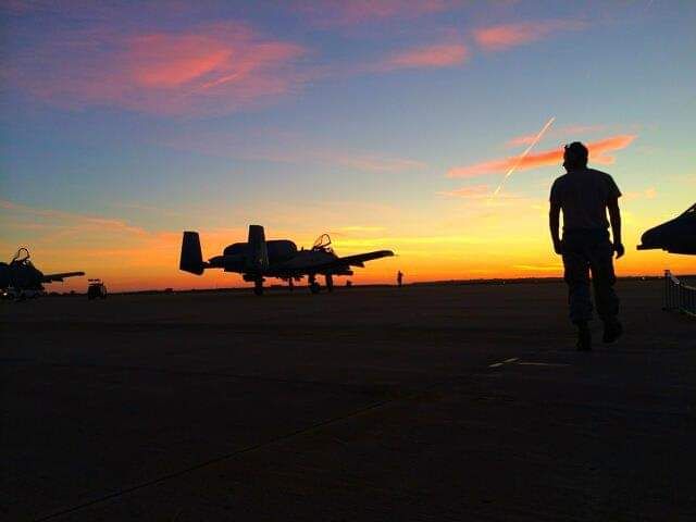 A-10 aircraft at sunset on a flightline