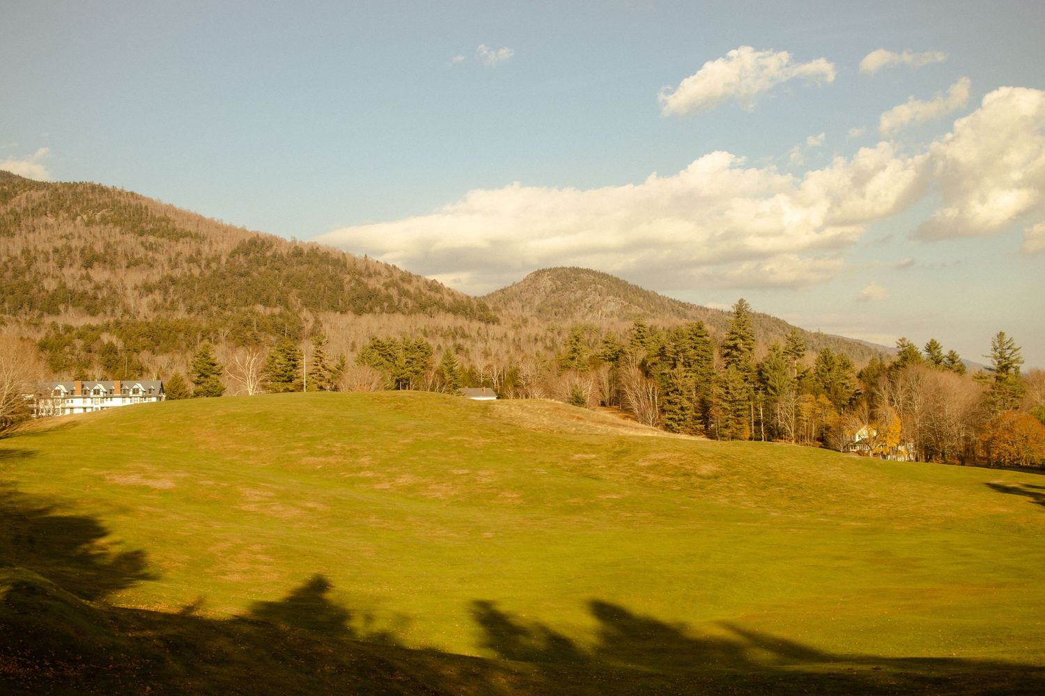 A beautiful landscape view of a clearing and mountains at the start of the trail to Indian Head.