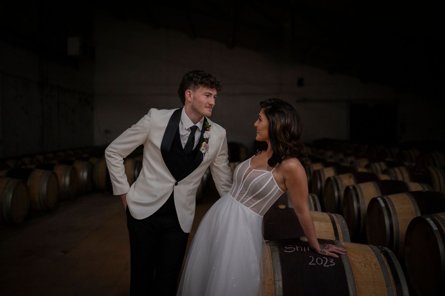 A couple sharing an intimate dance moment together in formal attire in a ballroom setting.