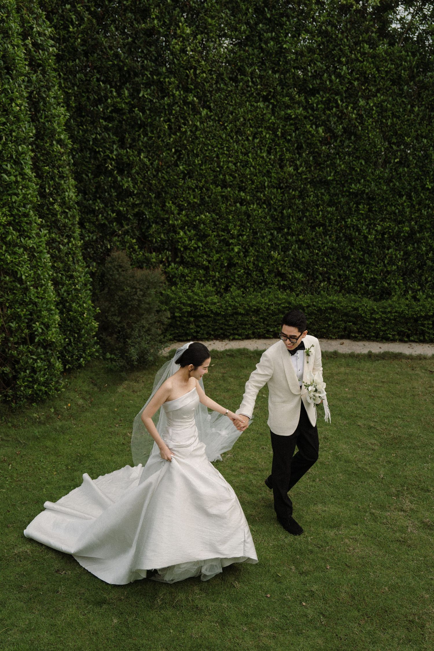 Dynamic wedding photo sequence capturing movement of bride's dress during outdoor shoot.