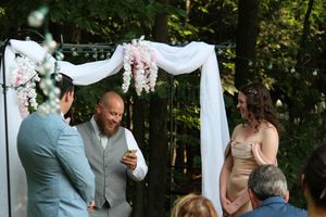 Candid photo of marriage ceremony during wedding photo session.