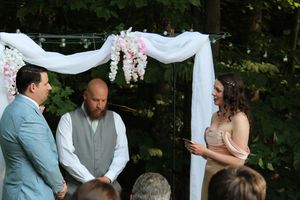 Candid photo of marriage ceremony during wedding photo session.