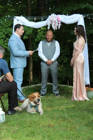 Candid photo of marriage ceremony during wedding photo session.