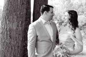 Married couple poses during wedding photo session.