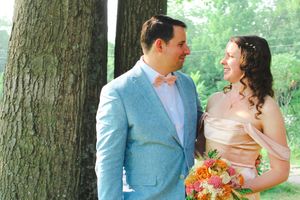 Married couple poses during wedding photo session.
