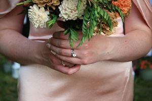 Close up of bride's rings during wedding photo session.