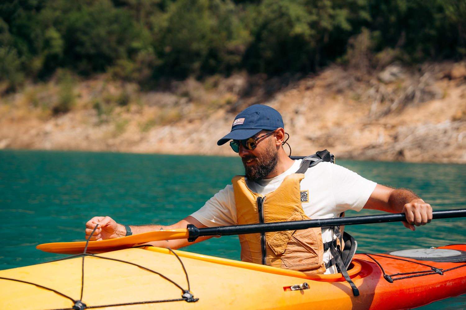 Luxury travel photographer and filmmaker during kayaking expedition in Spain