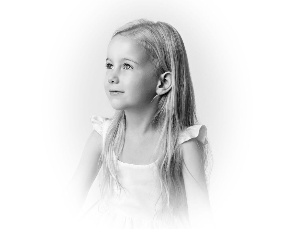 Series of soft, dreamy portraits with white background and gentle side lighting.