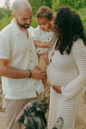 Sweet family photoshoot sequence in natural lighting showing tender moments together in white summer outfits.