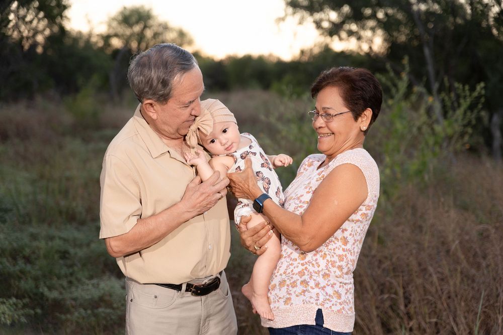 A series of candid outdoor portraits showing tender moments between two people at sunset in a natural setting.
