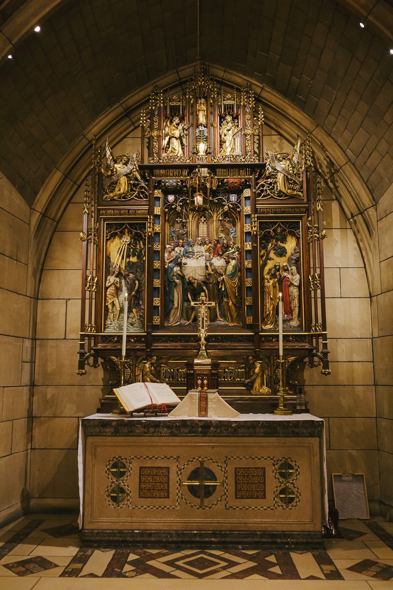 Baptismal font and cross at St. Thomas Church NYC captured by family photographer Paula Brearley