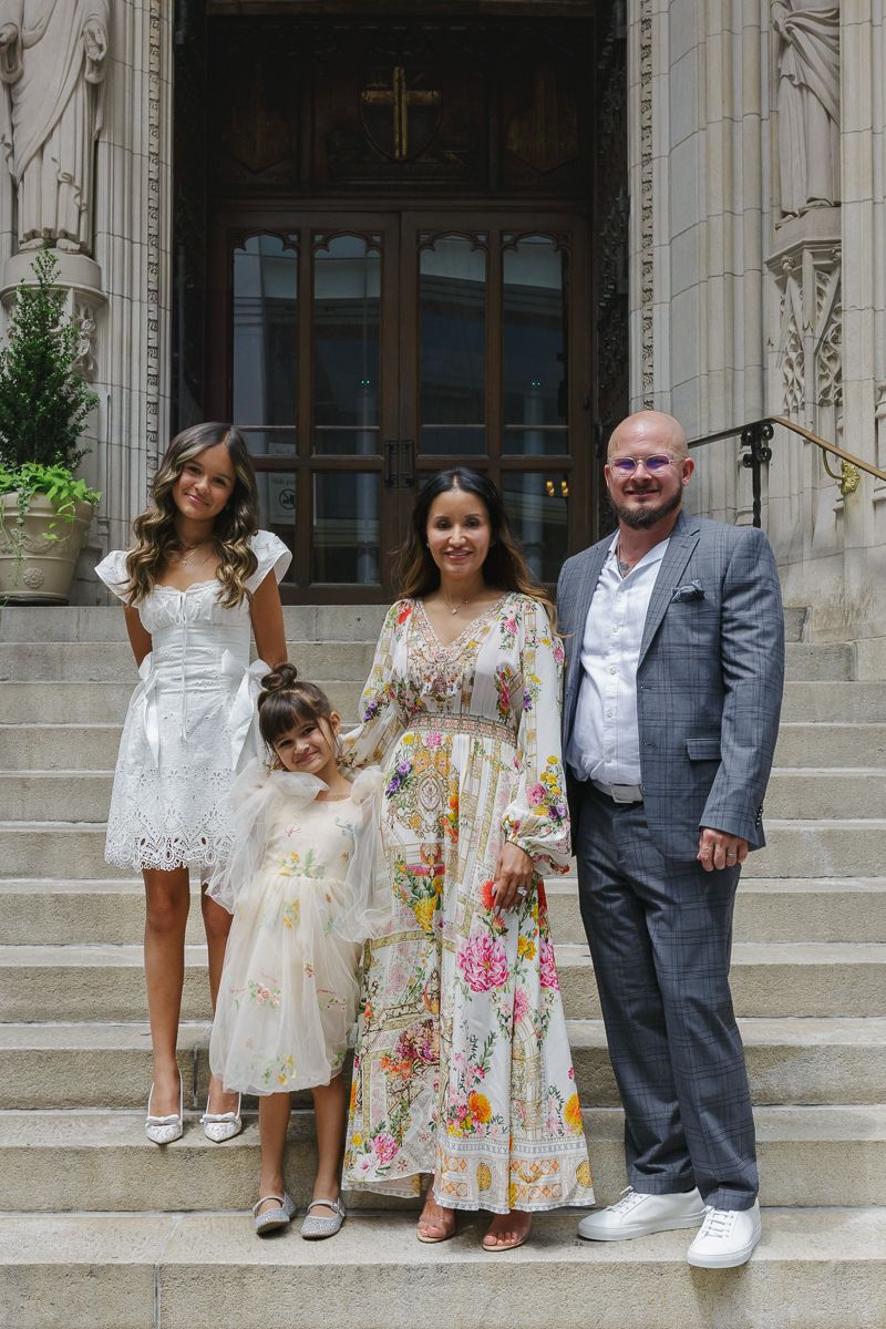 Parents with baptism girl and sister at St. Thomas Church steps, photo by Paula Brearley