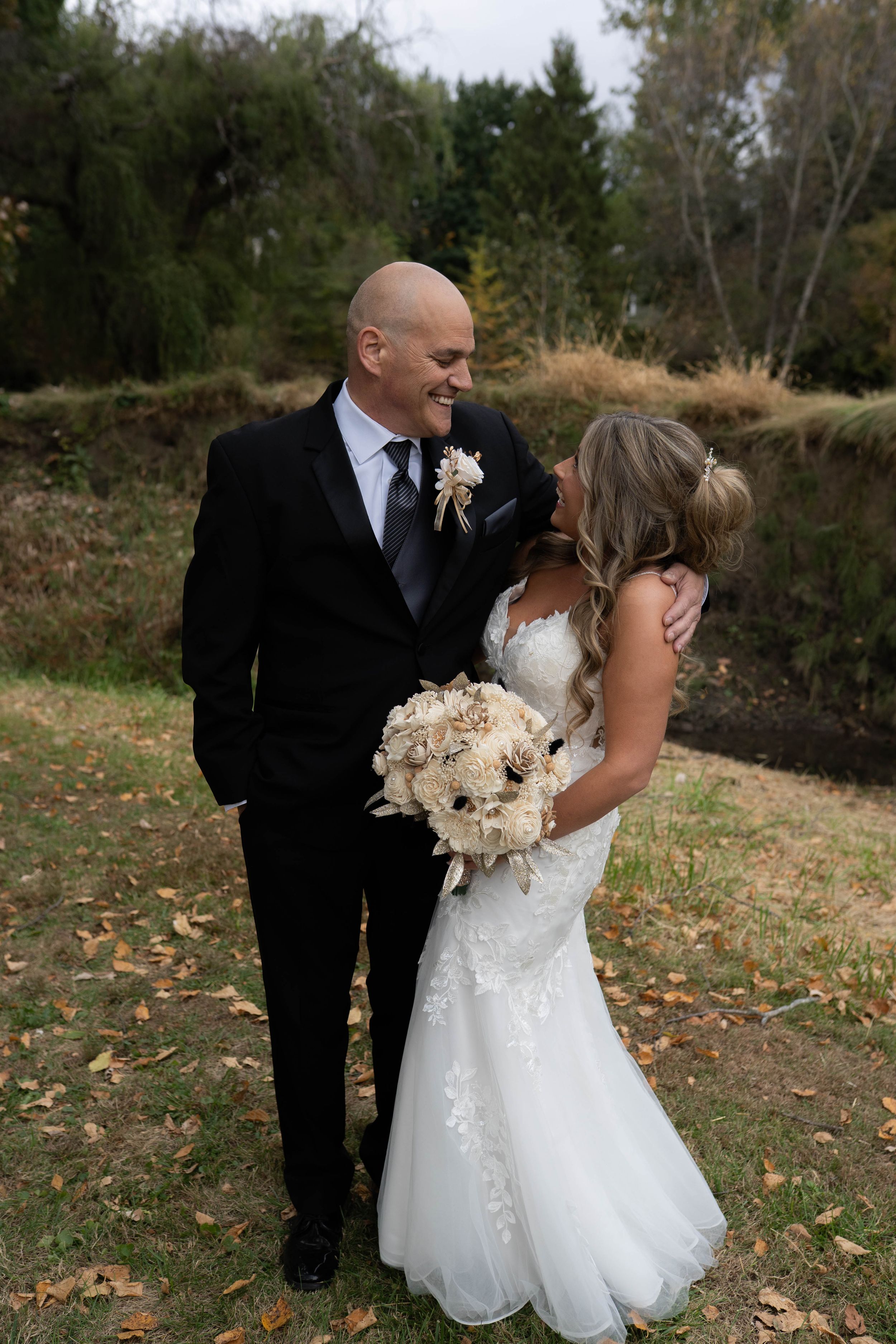 Newlyweds share intimate moments during their fall outdoor photo session.