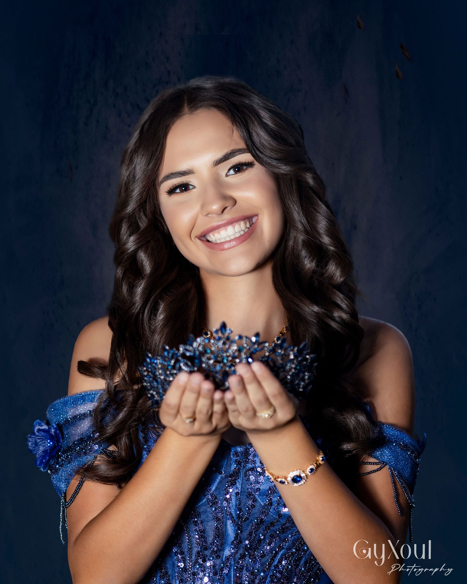 A series of expressive portraits in a blue sequined dress against a dark background showing joyful and playful poses.