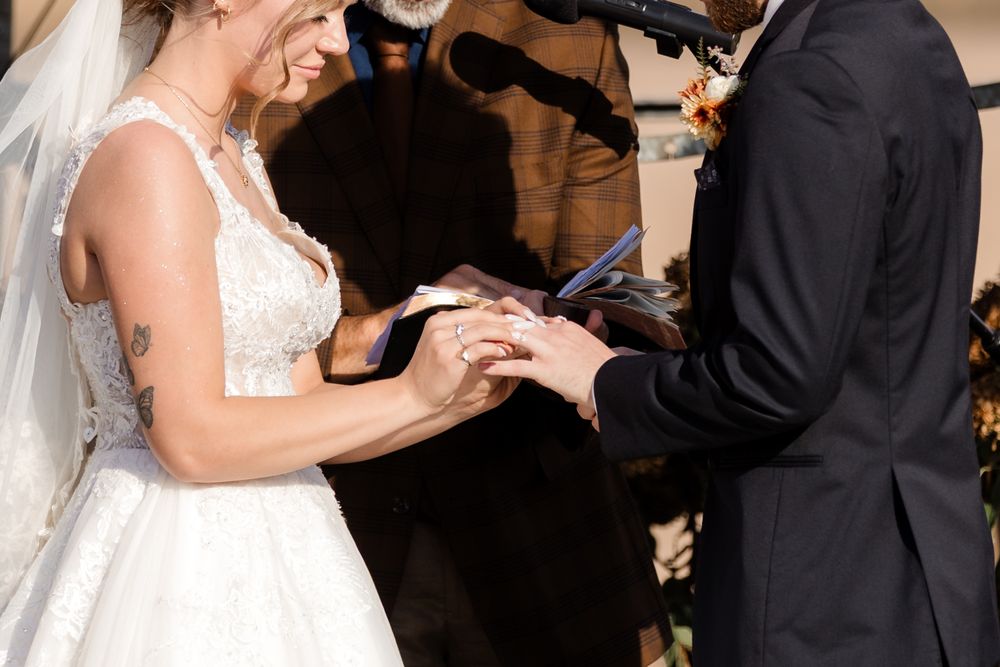 A bride and groom share their first dance together at a wedding reception.