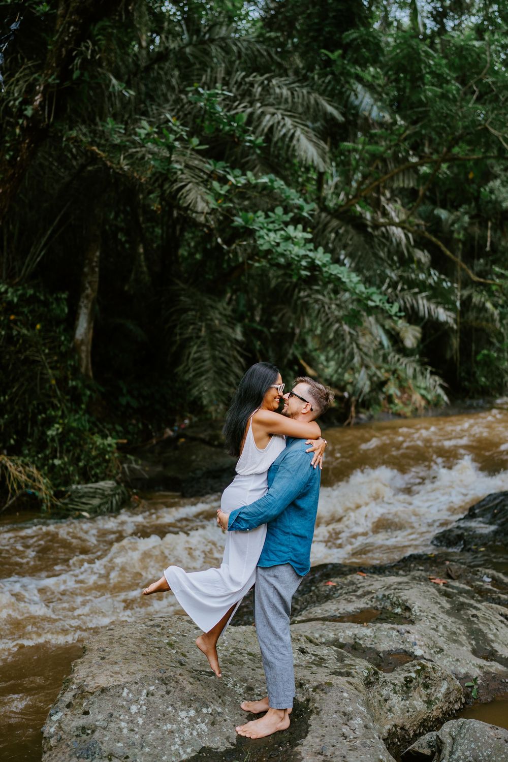 Romantic couple photography in Bali by a natural river Ubud