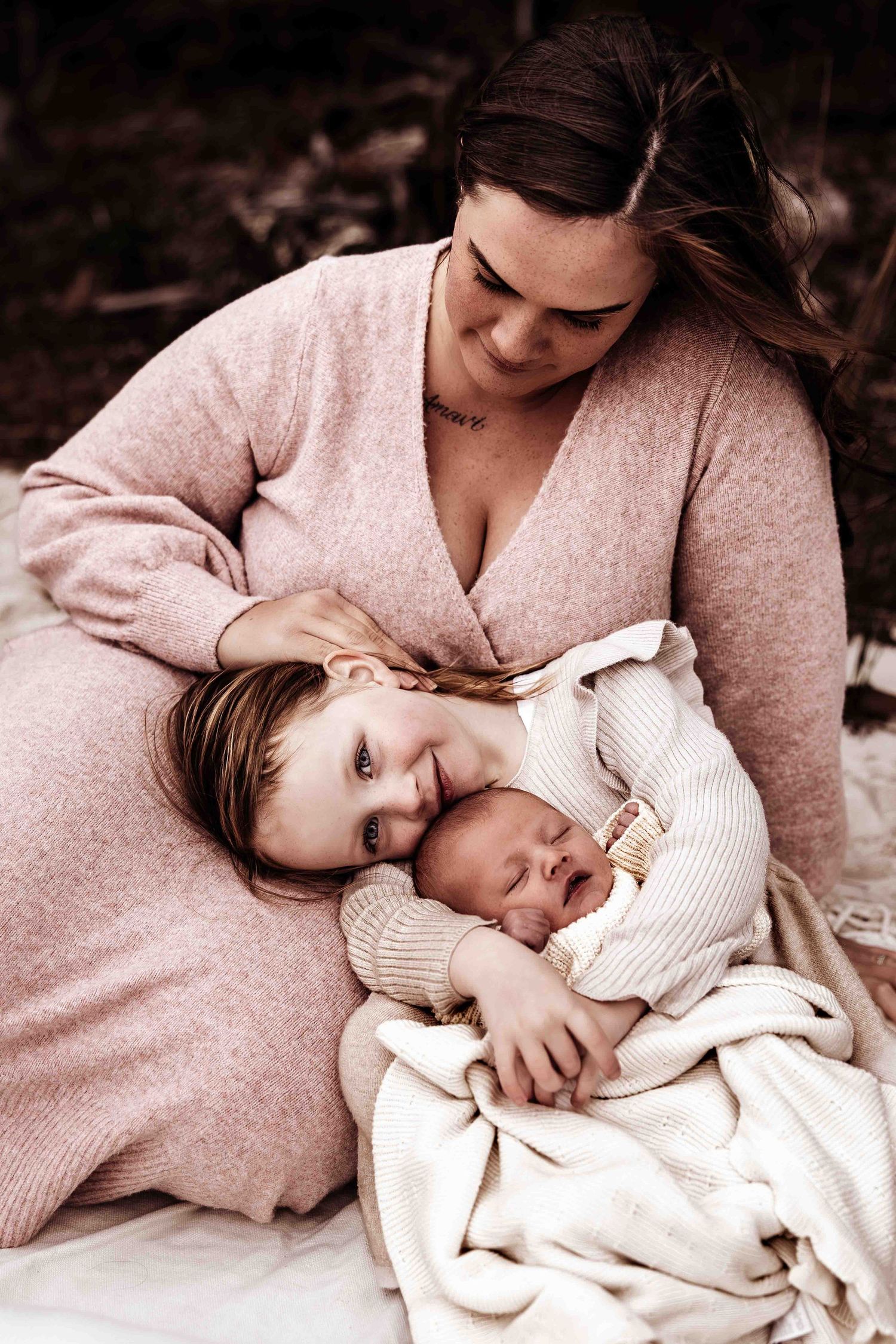 Newborn photography on the beach in Jervis Bay now. mother & newborn baby & child sitting on the beach. newborn photos