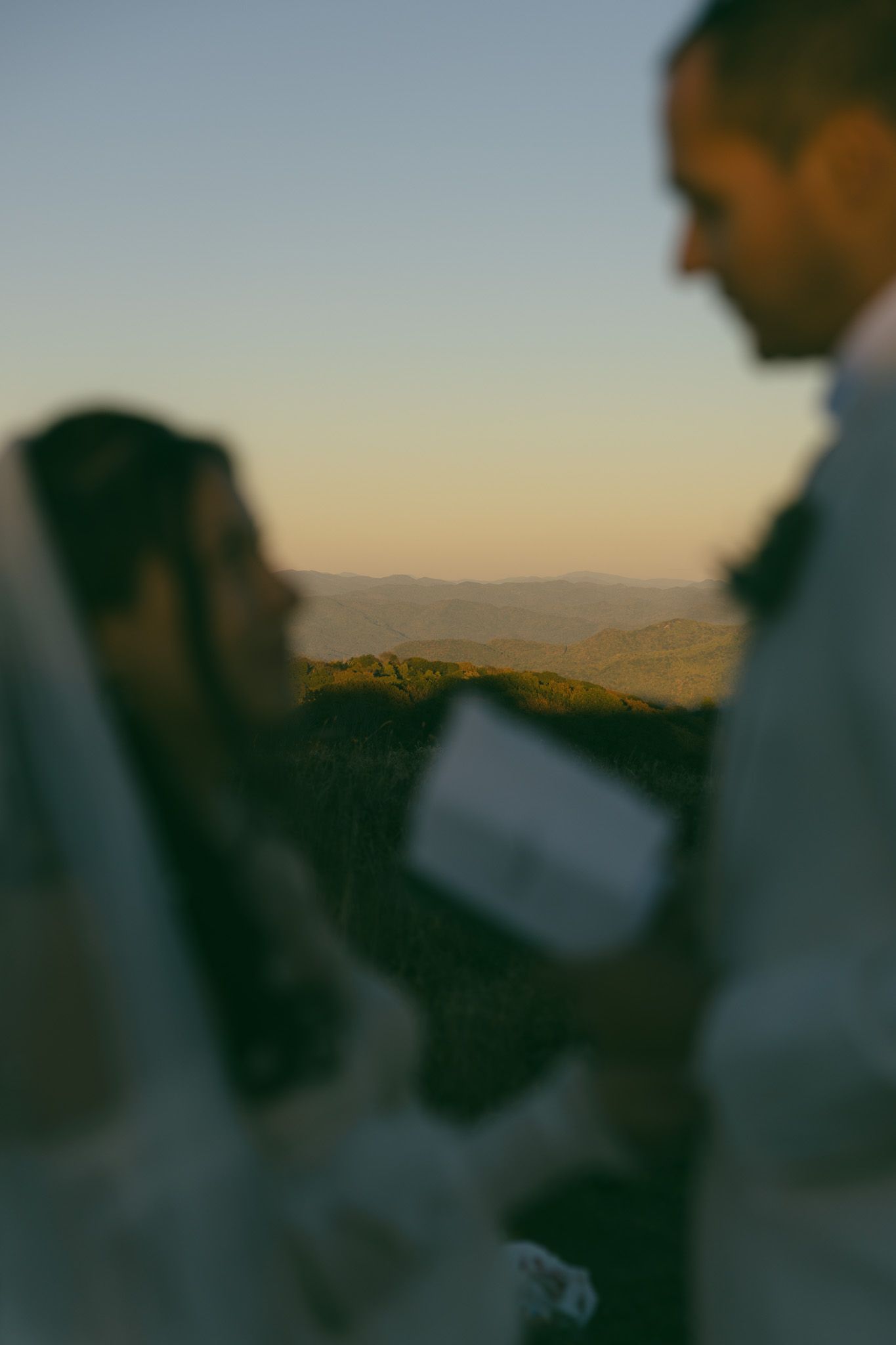 blue ridge mountains sunset elopement wedding day bride groom kissing dress asheville fall trees private vows