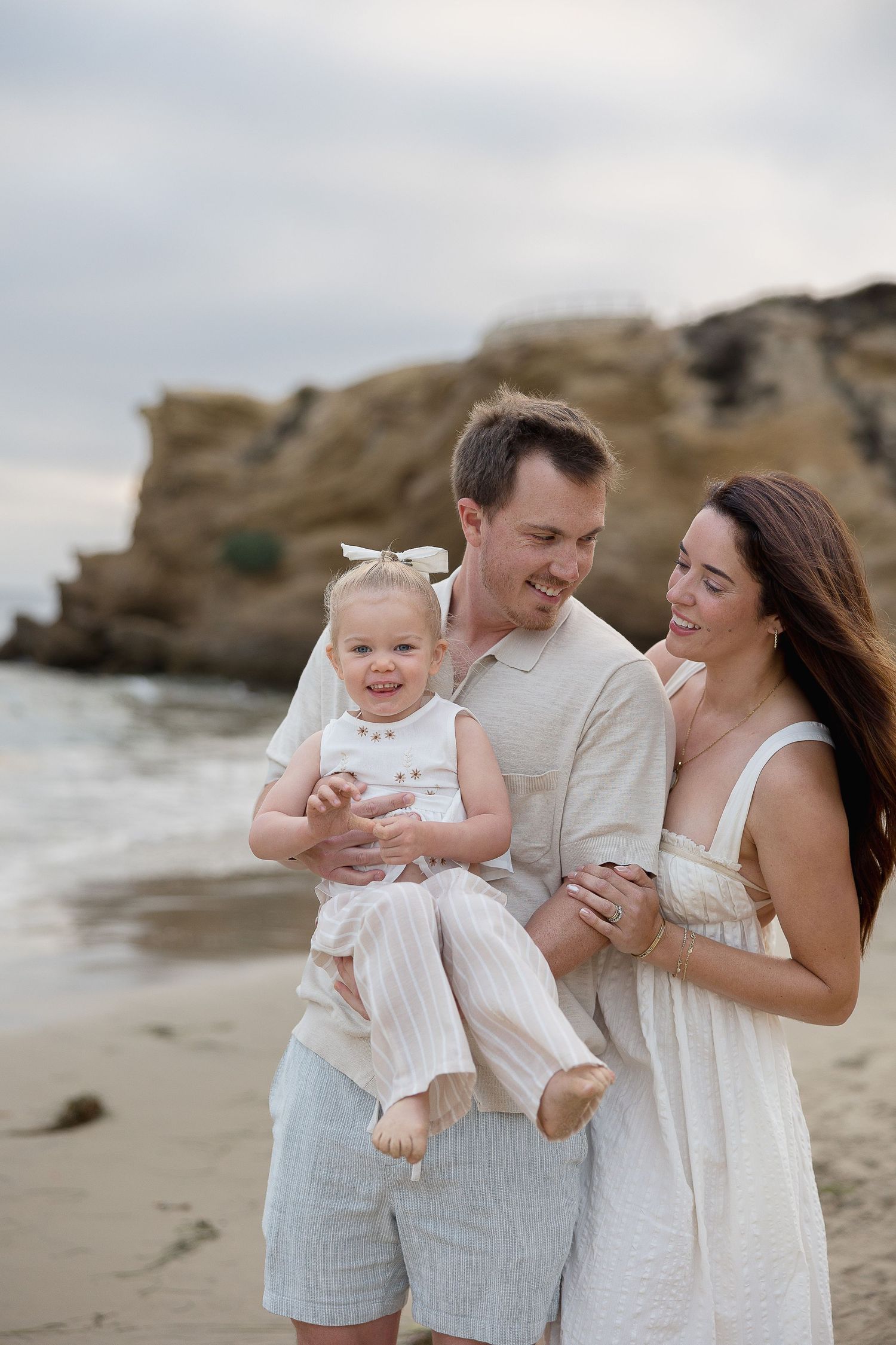 Orange County family photographer shooting beach photos at Crystal Cove
