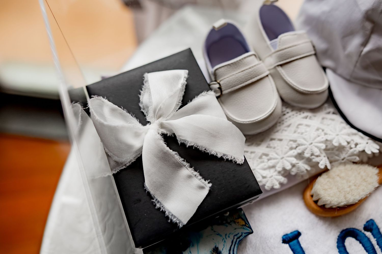 Close-up view of wedding ceremony preparations with white decorative elements and blue accents.