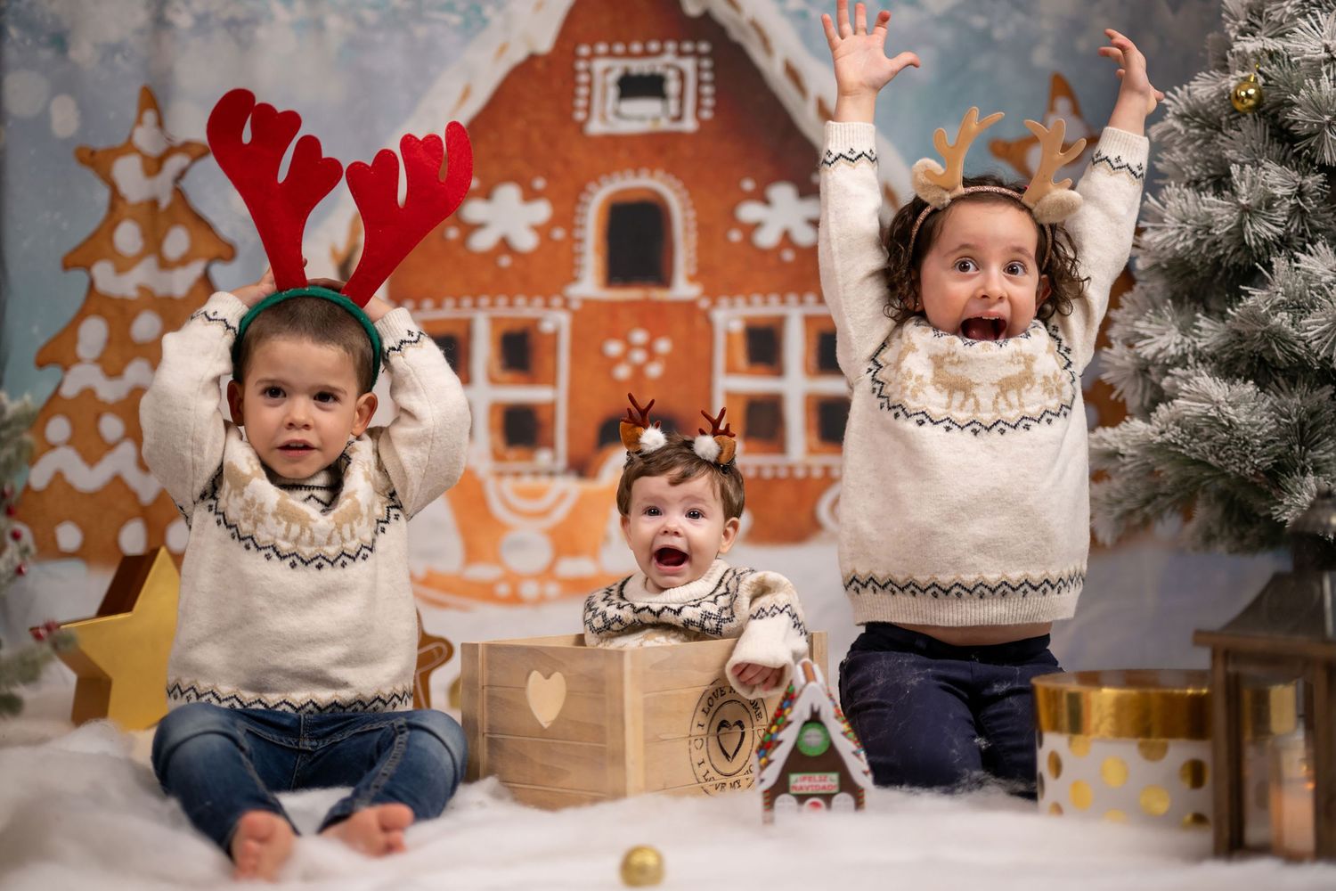 A family enjoys holiday moments together in a cozy living room decorated with a Christmas tree.