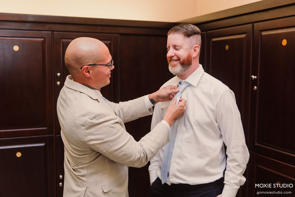 A series of photos showing someone adjusting a tie and collar on another person wearing formal attire.