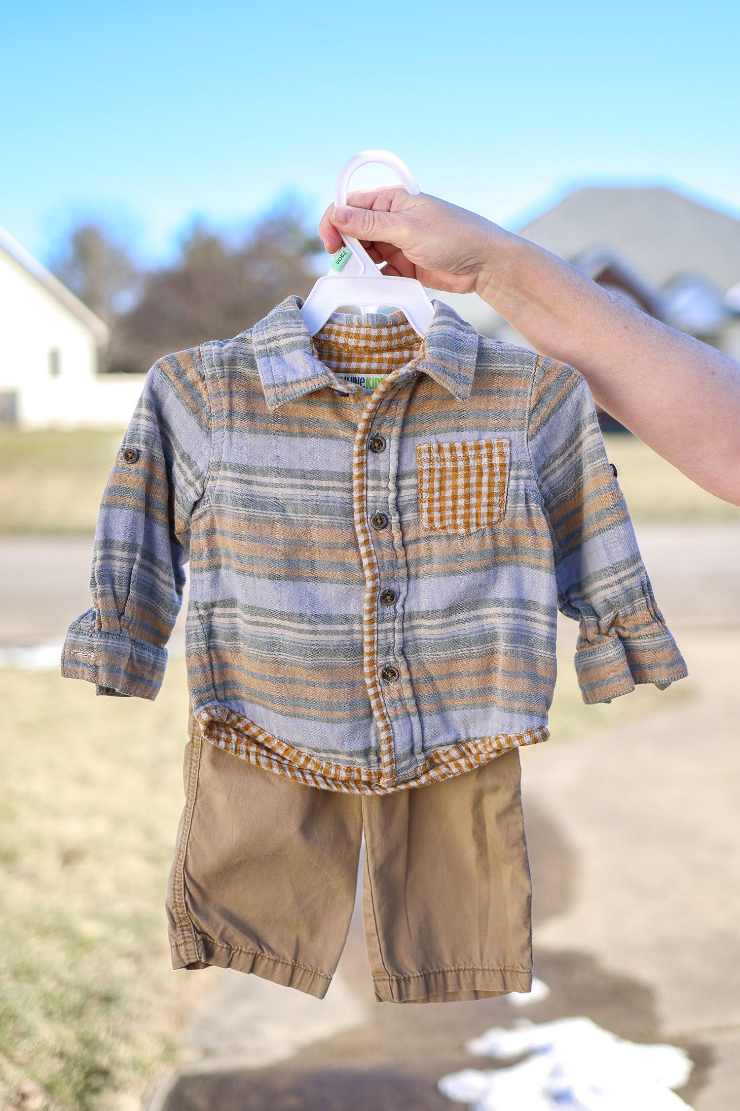 Central IL family photographer's client closet features a neutral color plaid outfit