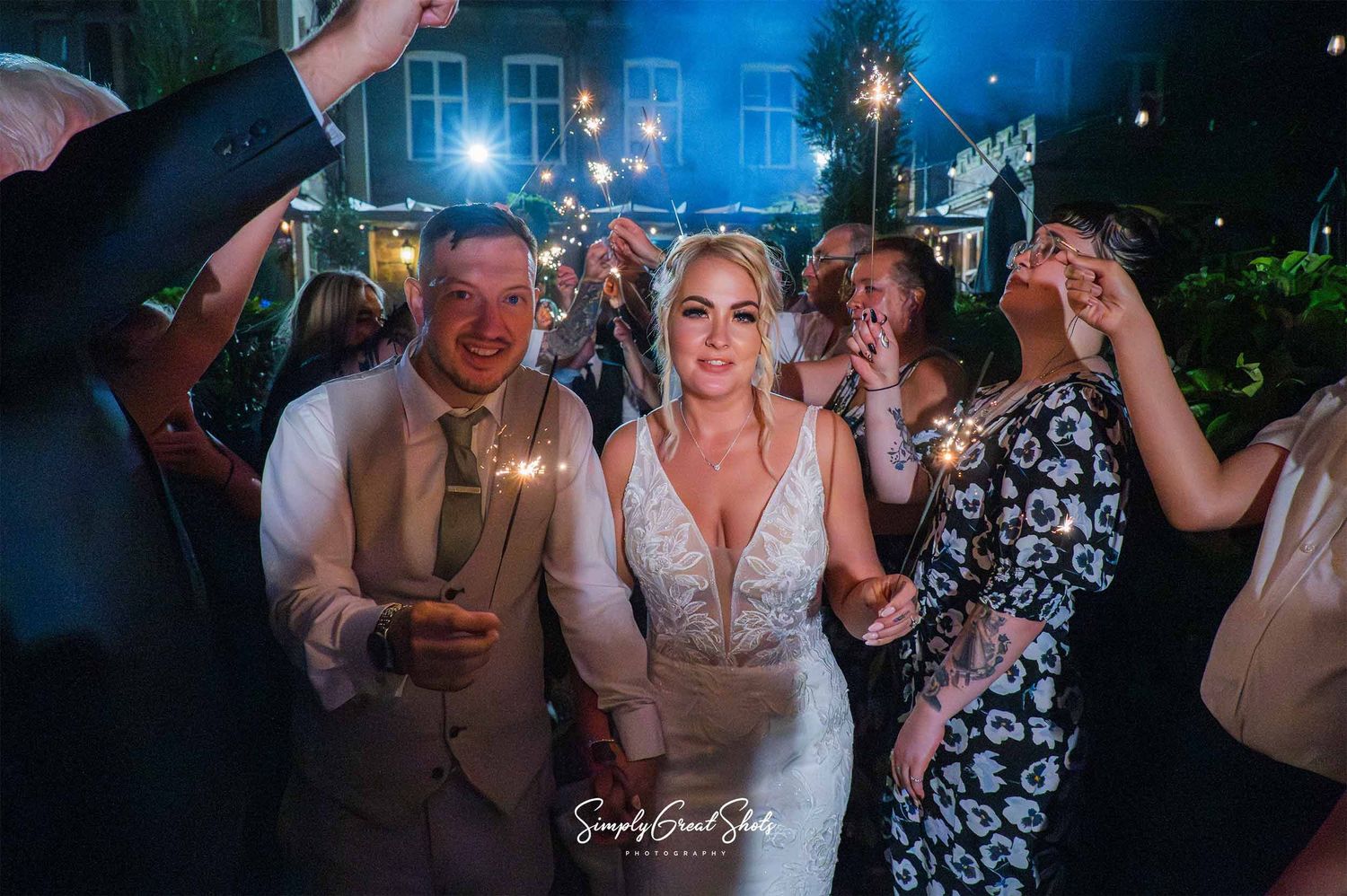 Rothley Court wedding photographer captures bride and groom sparkler exit at night,