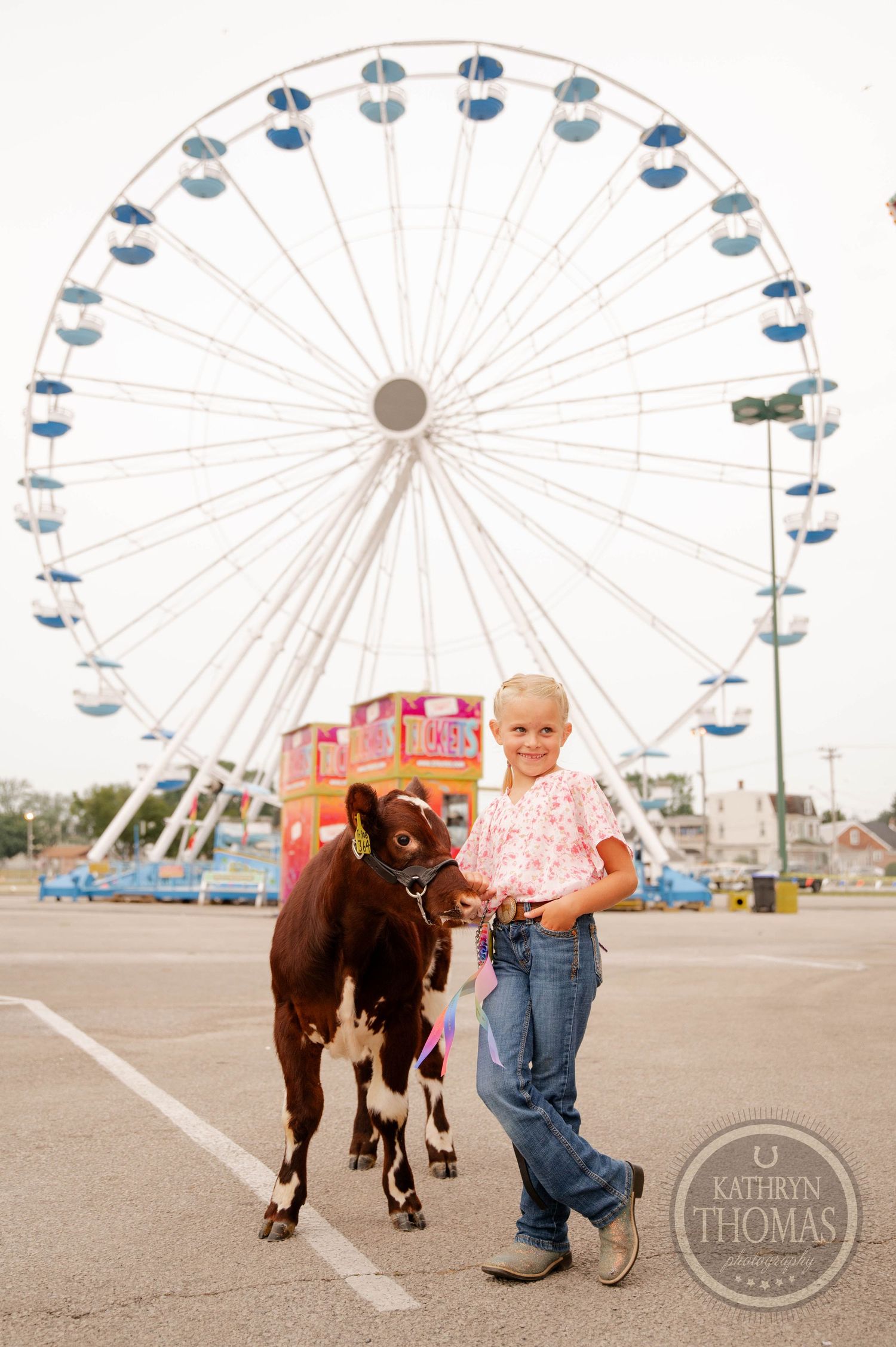 Prize-winning livestock and a towering Ferris wheel create a classic scene at a state fair.