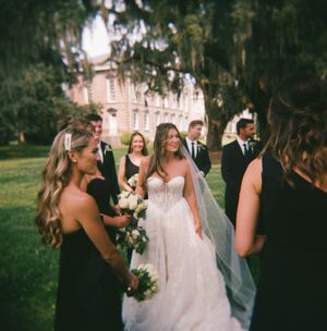 A wedding celebration sequence showing candid moments of dancing, laughter and joy between people in formal attire.