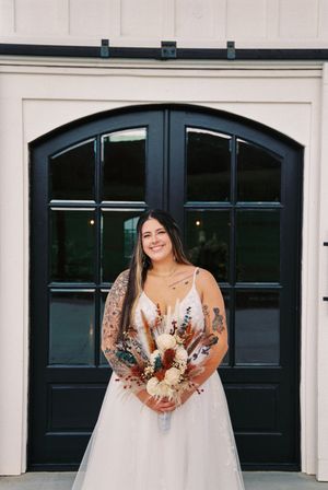 A bride in a white wedding dress and long veil poses in front of black garage doors in a multi-panel collage.