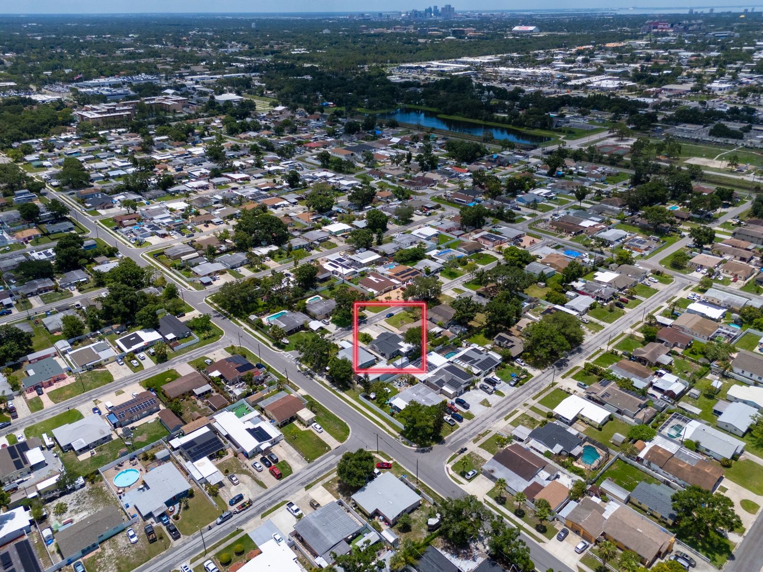 Aerial view of residential neighborhood with uniform houses and streets in a suburban community.