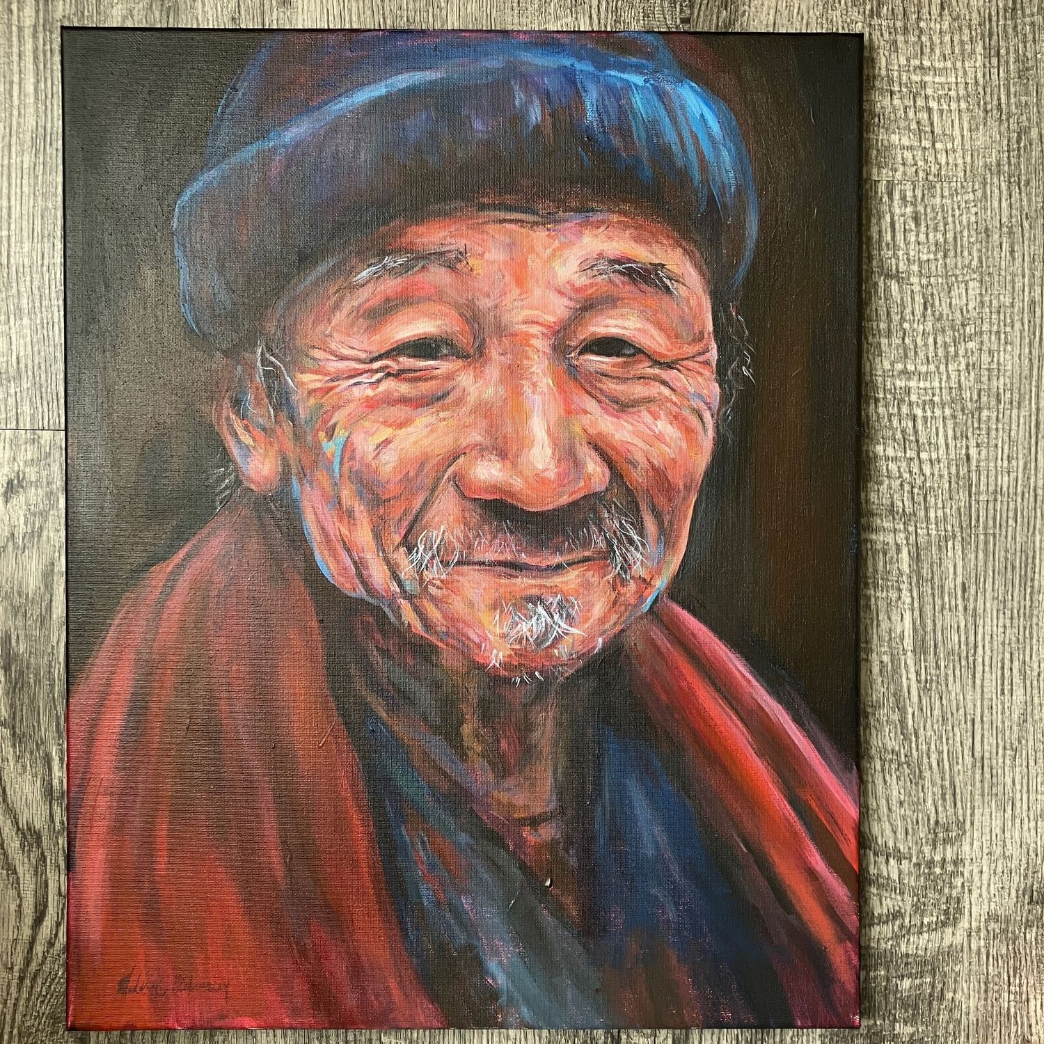 A vibrant acrylic portrait of an elderly man wearing a knit cap and red scarf, with expressive winkles and a gentle smile
