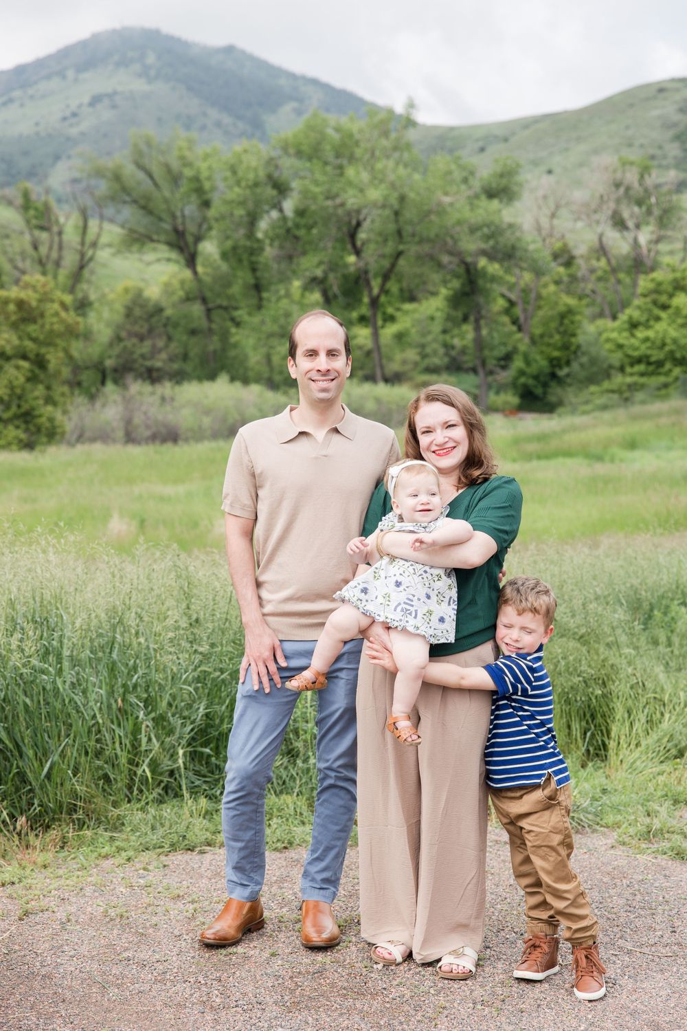 Family outdoor portrait session showing progression of poses in a scenic mountain meadow setting.