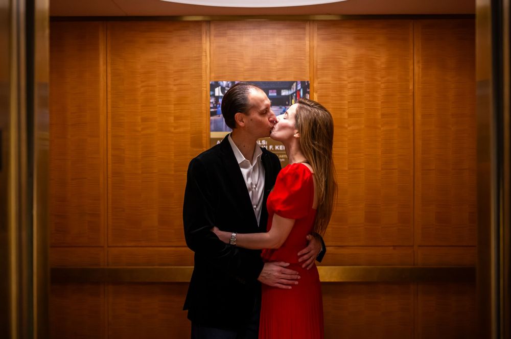 Elegant family photo session at the Kennedy Center in Washington, D.C., featuring stunning indoor chandeliers, panoramic