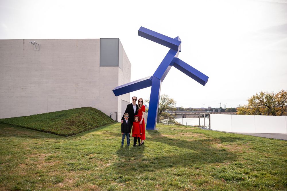 Elegant family photo session at the Kennedy Center in Washington, D.C., featuring stunning indoor chandeliers, panoramic