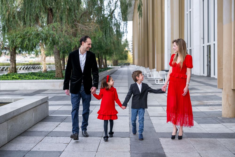 Elegant family photo session at the Kennedy Center in Washington, D.C., featuring stunning indoor chandeliers, panoramic