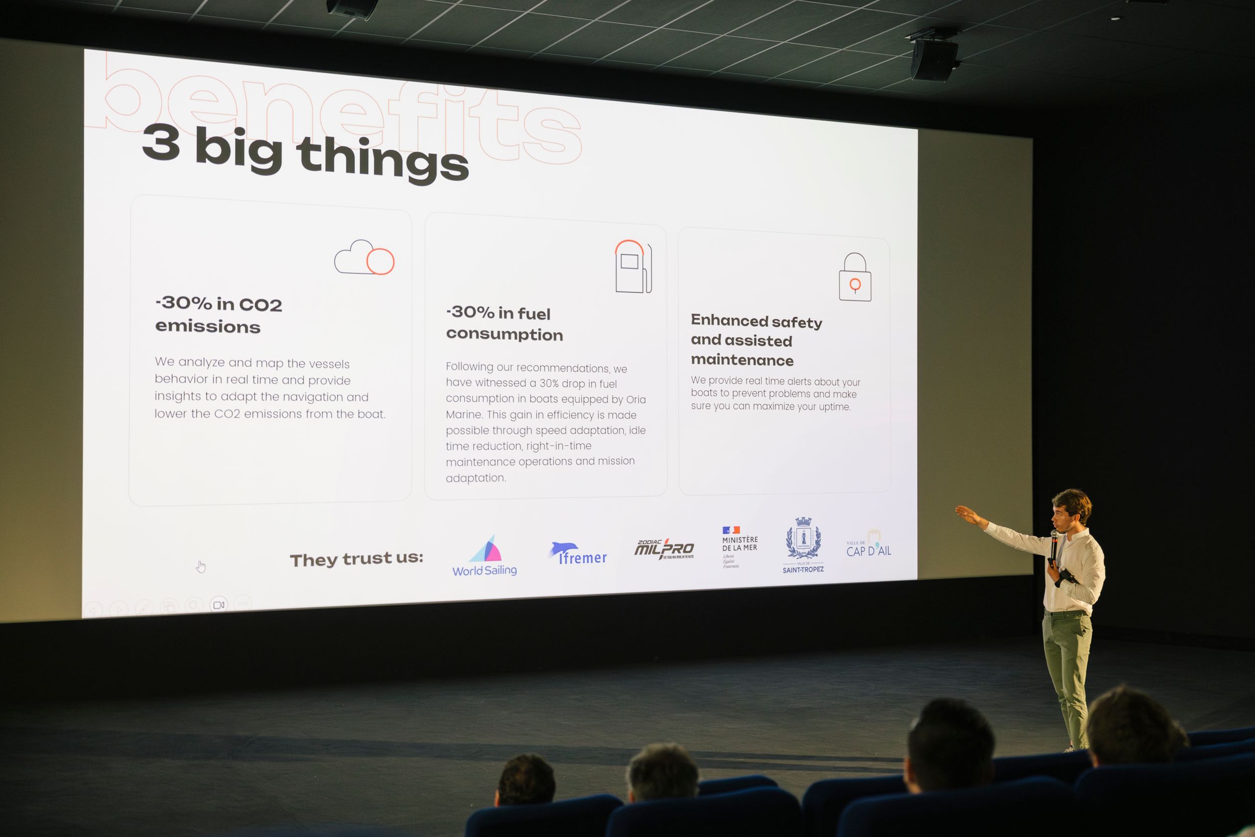 Speaker presenting '3 big things' slide during a business presentation in an auditorium.
