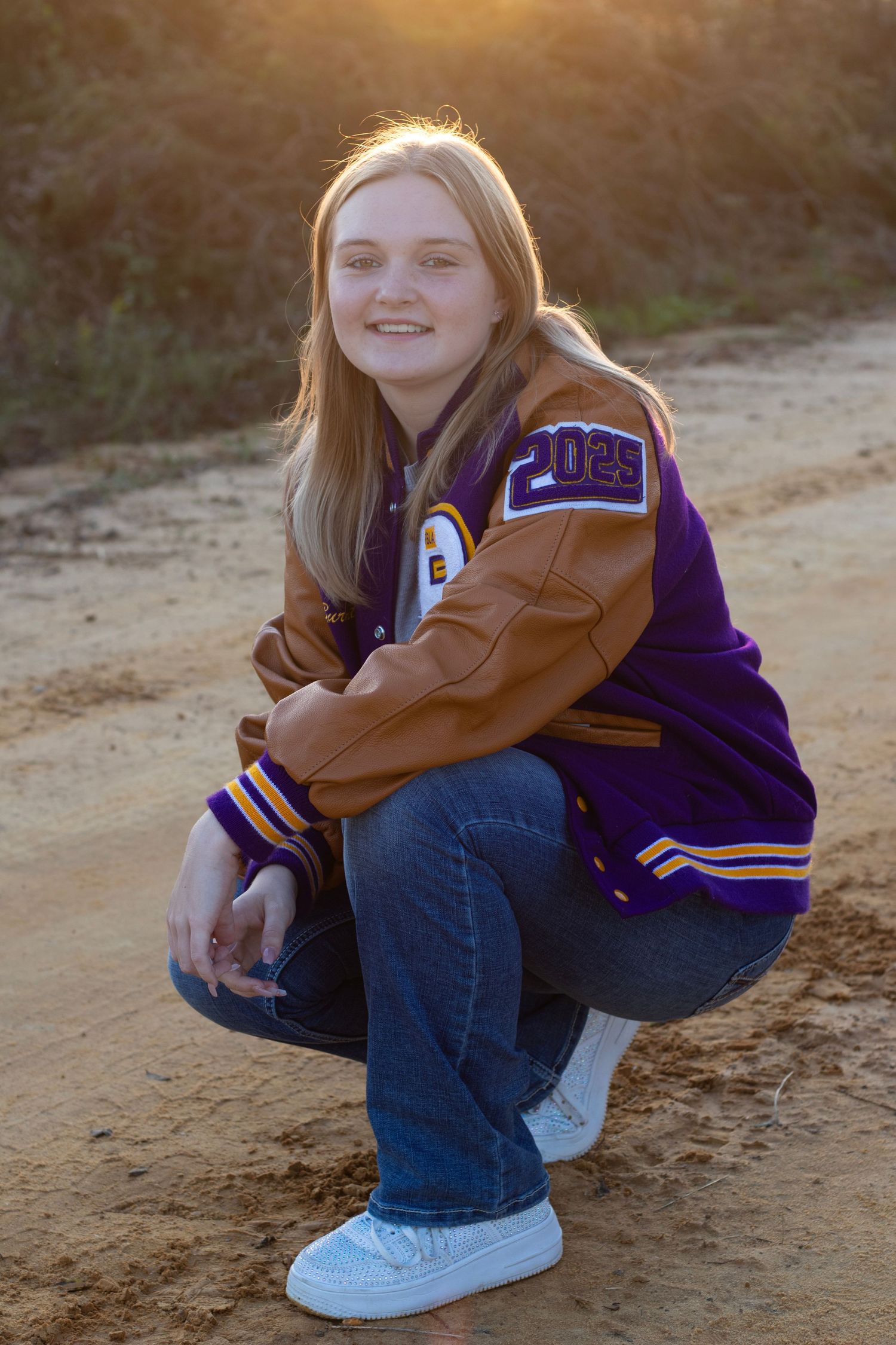 Senior girl on dirt road for photo session
