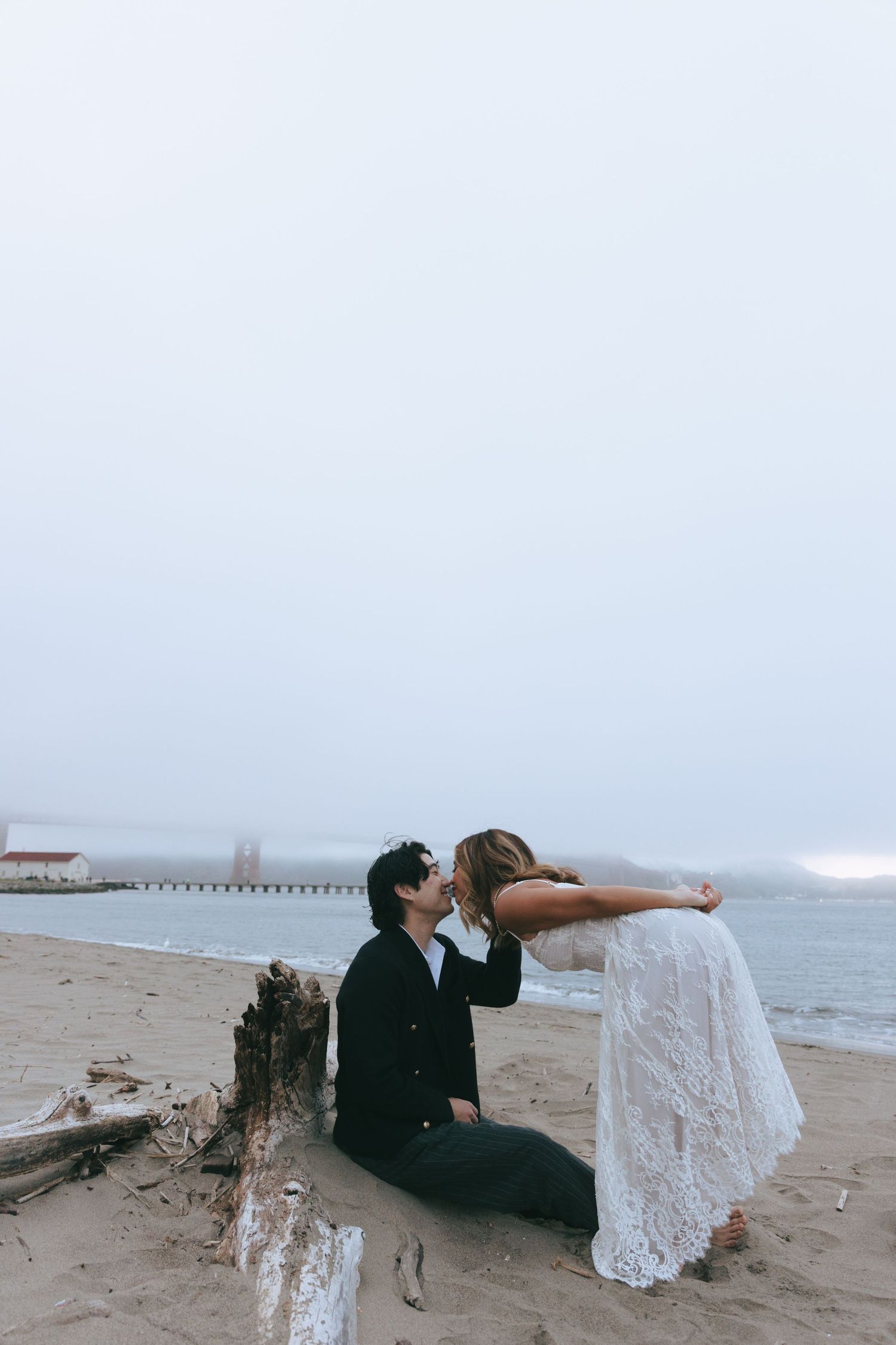 Bride and groom standing together during a wedding ceremony in an elegant historic venue.