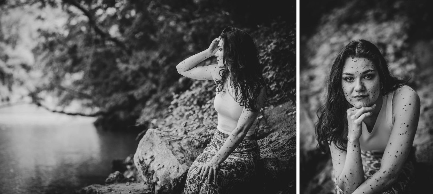 Black and white portraits captured in a natural outdoor setting near a lake with rocks and trees in the background.