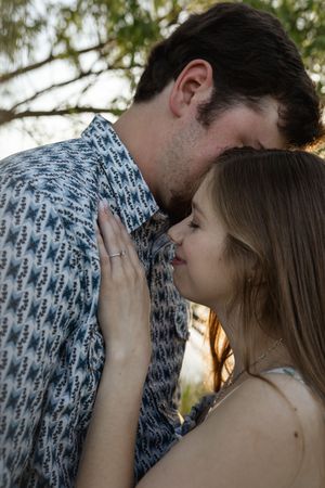 Intimate close-up shots of a couple sharing romantic moments during their engagement session.