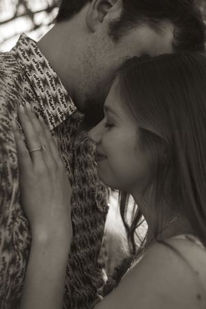 Black and white intimate portraits of a couple during their engagement photoshoot.