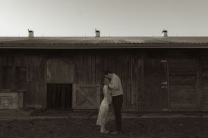 Rustic barn exterior with wooden details and natural lighting.