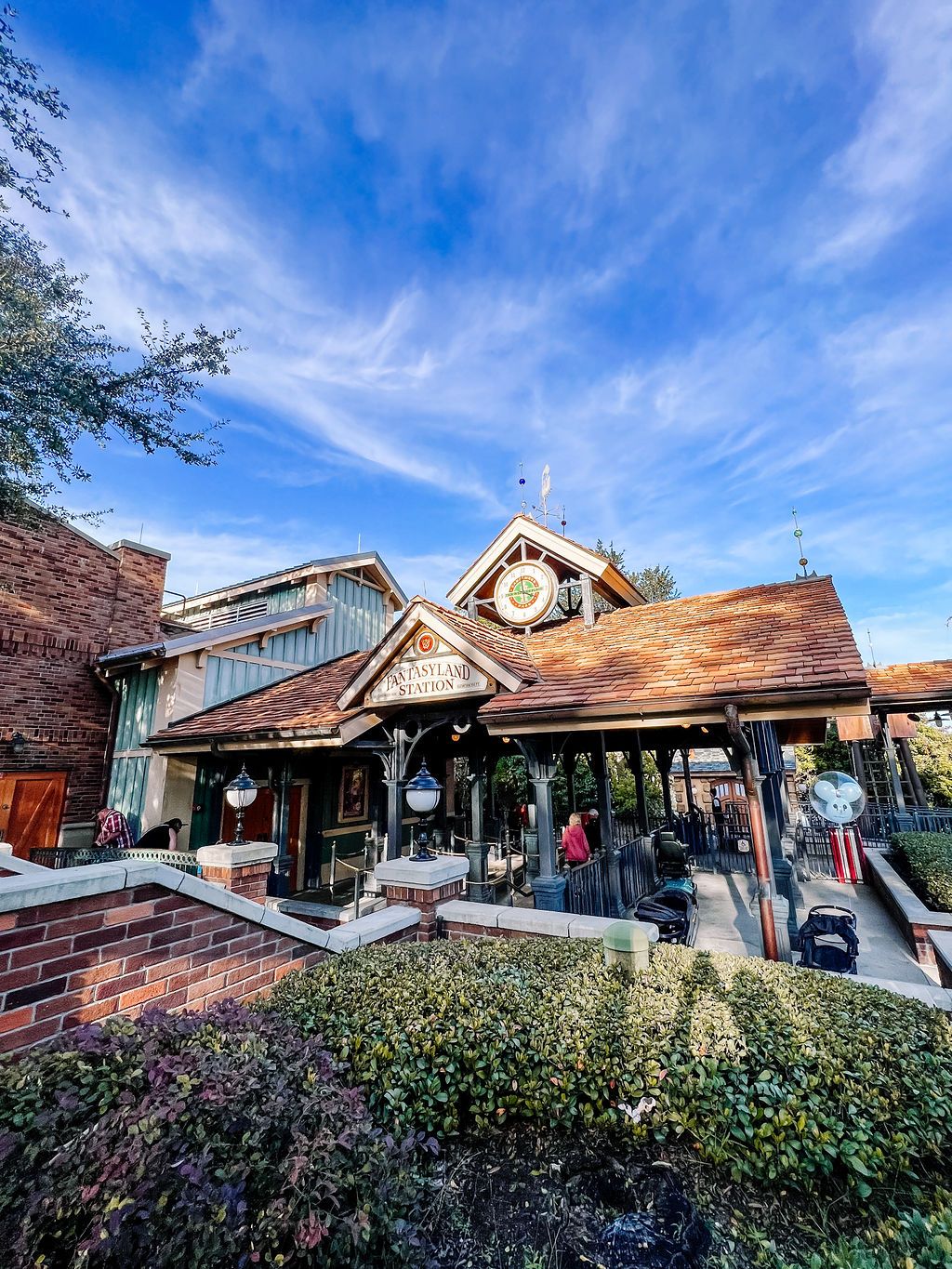 A rustic mountain lodge style building with wooden architecture and a sloped roof under vibrant blue skies.