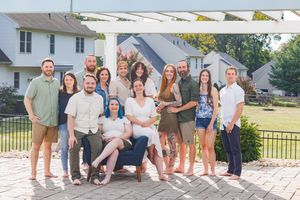 A collage of outdoor family group photos arranged in a horizontal strip showing casual gatherings and poses.
