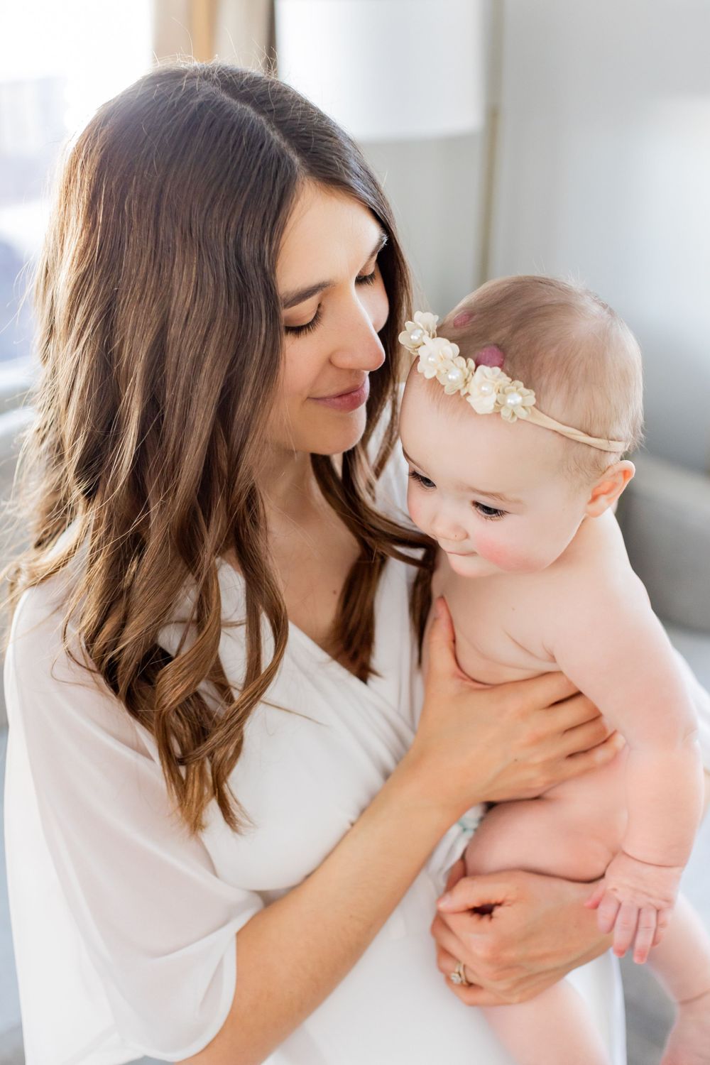 Sweet bonding moment in a bright, modern living room setting, in Springfield, Missouri.
