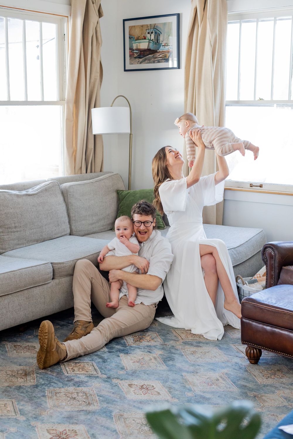 Family enjoying playful moments together in cozy living room in Springfield, Missouri.