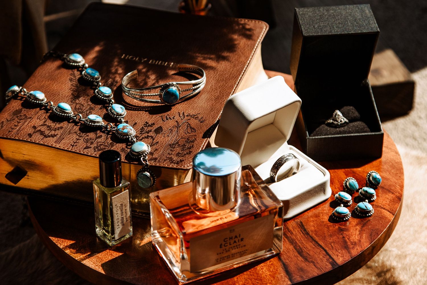 A sequence of close-up shots showing a vintage coffee grinder with turquoise accents against a rustic wooden surface.